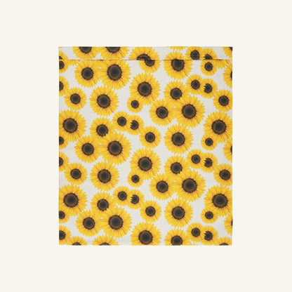 De waszak met witte achtergrond en print van gele zonnebloemen