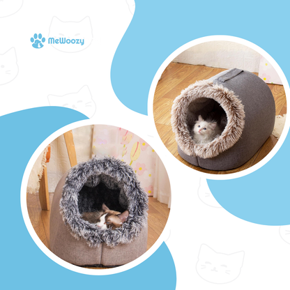 Twee kattenholen met kitten in de ingang en slapende kat binnenin