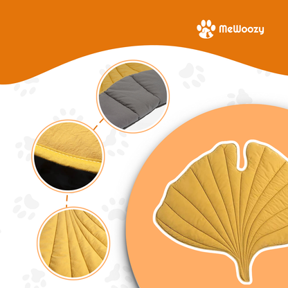 Close-ups van de gele deken: grijze onderkant, omgezoomde rand en stiksels