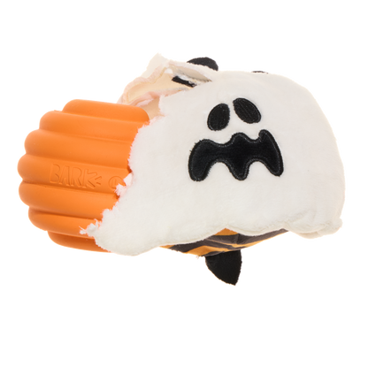 Opengescheurd spookje waaruit de oranje rubberen piepkern tevoorschijn komt