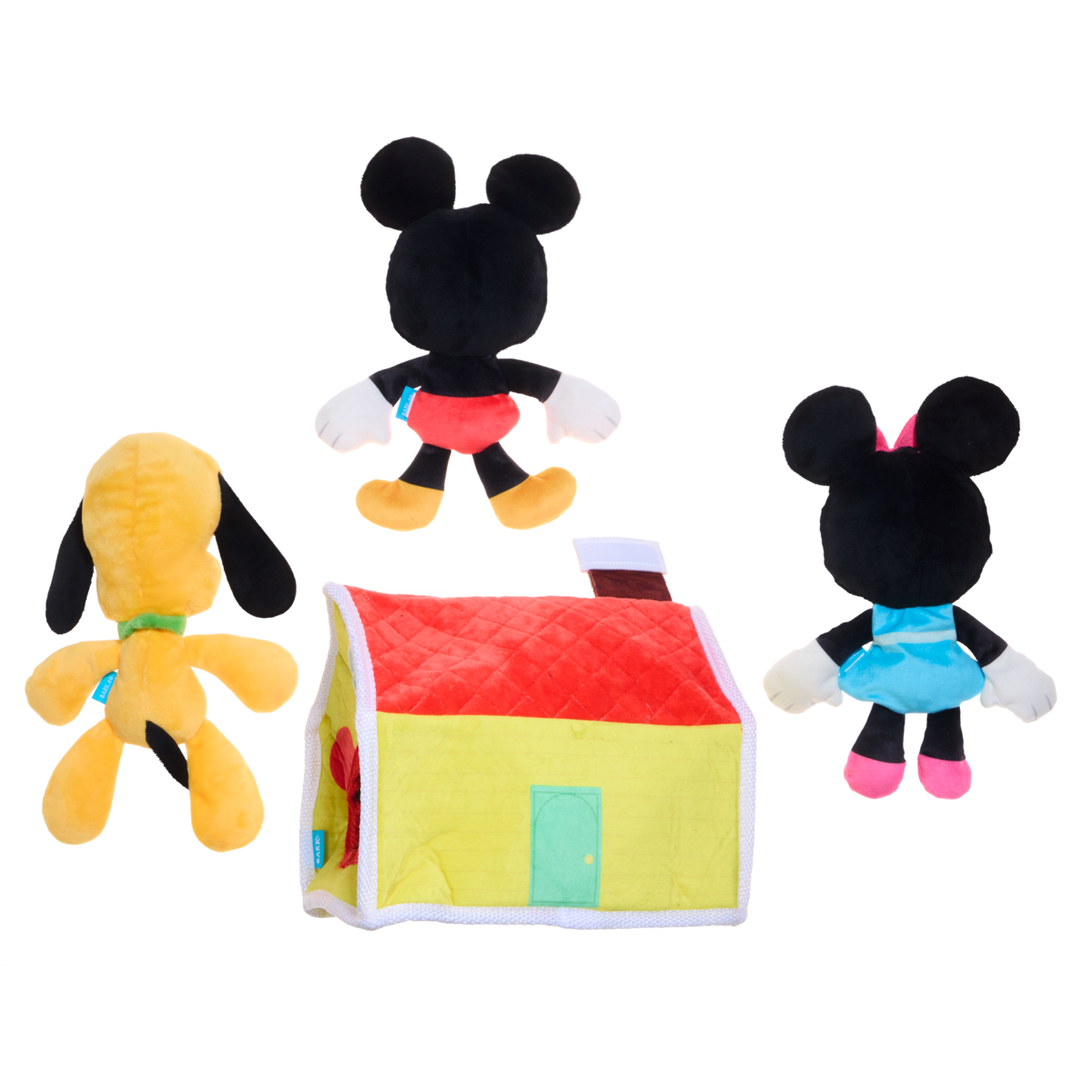 Achterkant van de drie knuffels en het gele huisje met rood dak