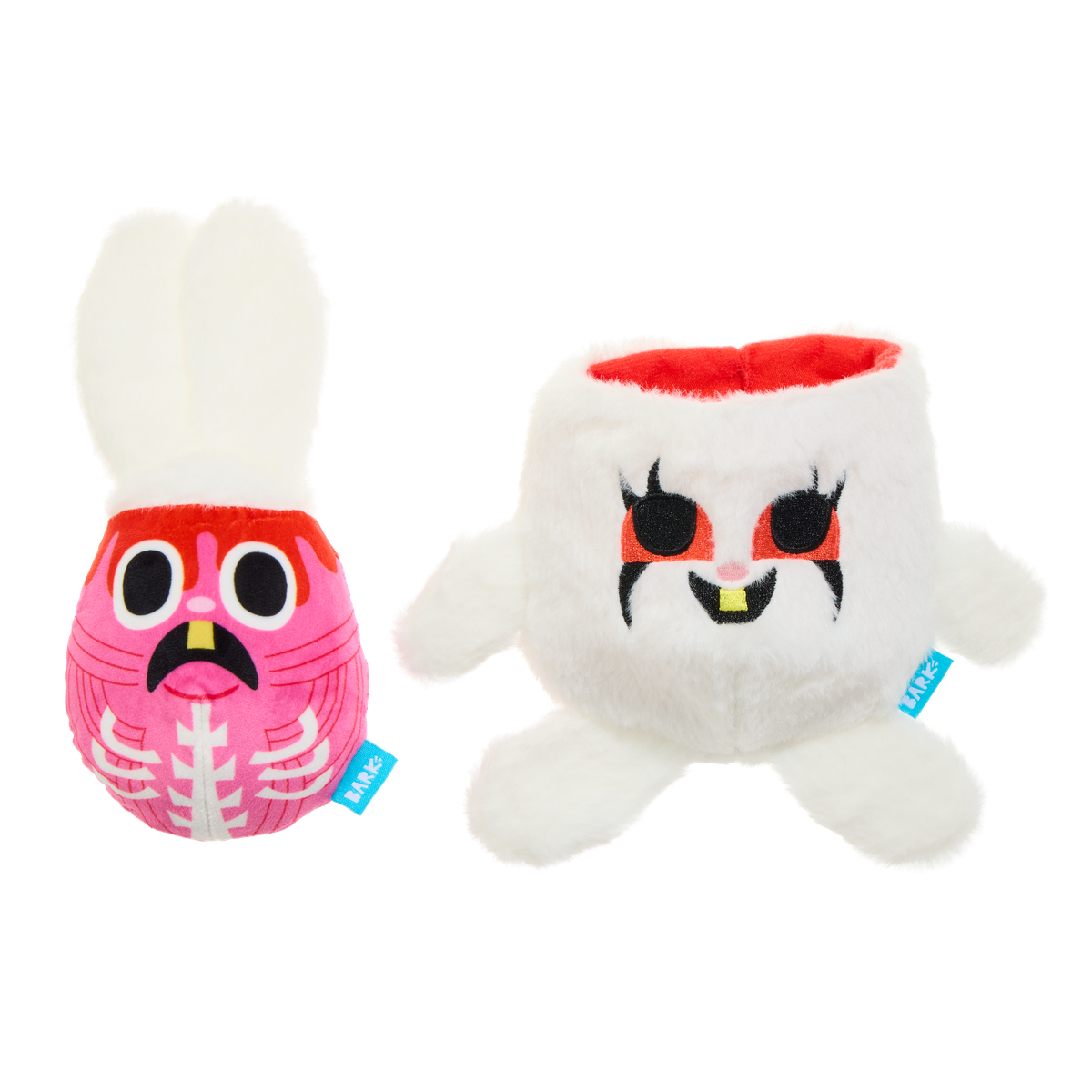 Roze binnenknuffel met skeletprint naast het open witte konijn met snackvak