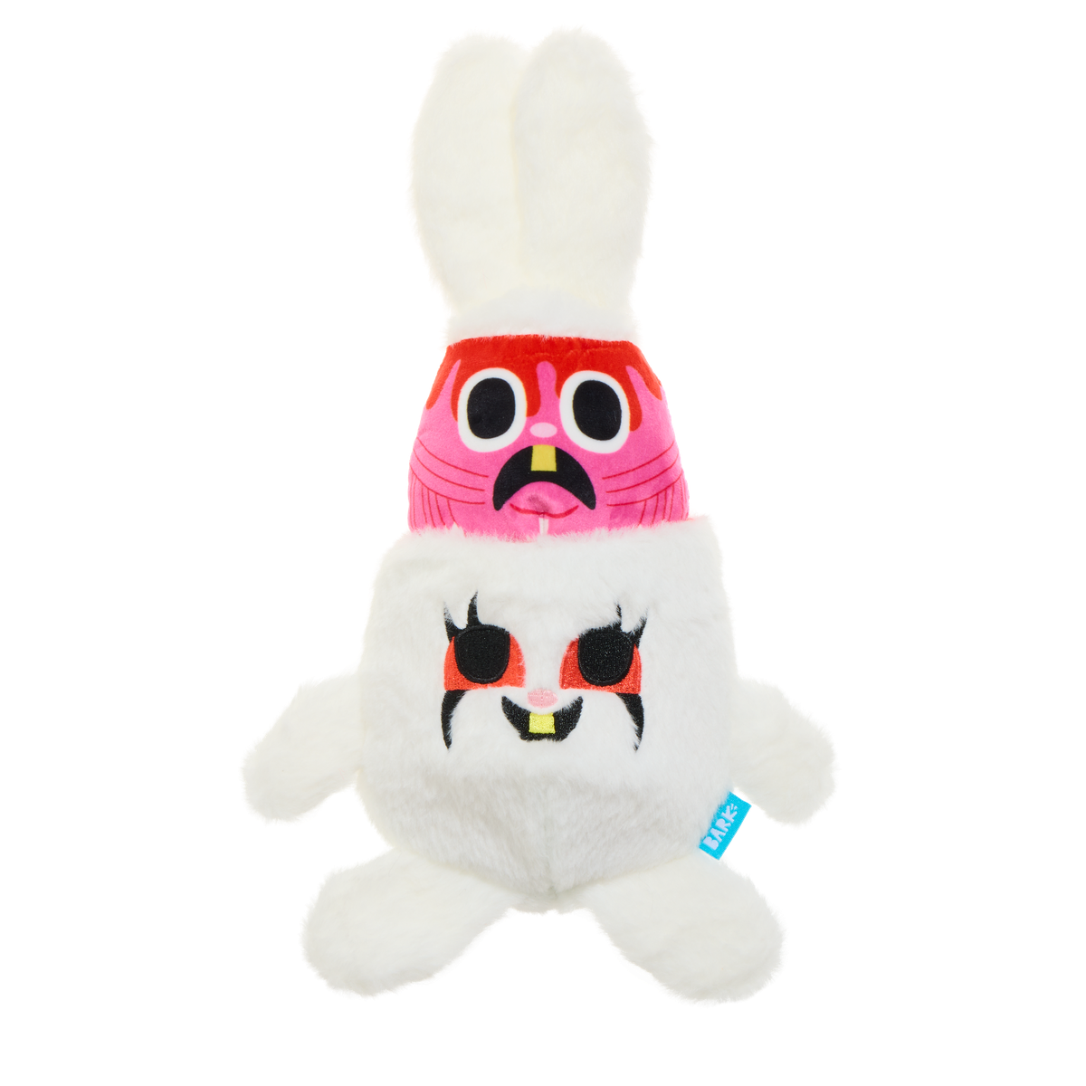 Het hondenspeelgoed in elkaar geschoven met roze binnenknuffel en witte oren