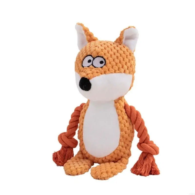 De knuffel als oranje vos met witte buik en touwarmen