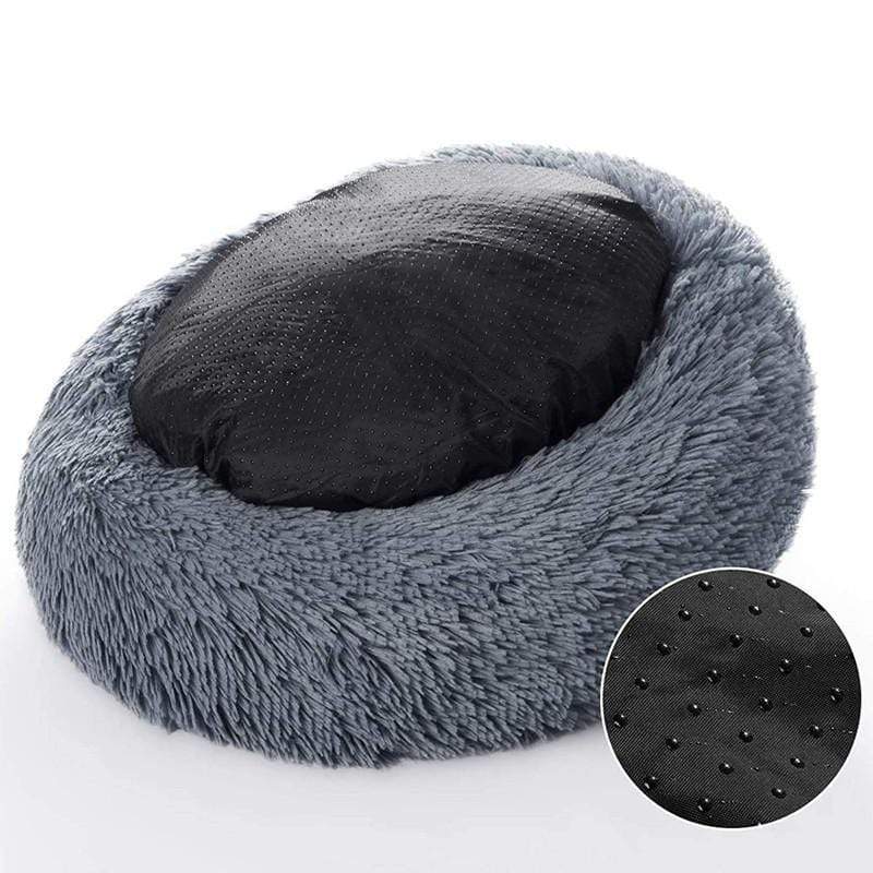 Donkergrijze kattenmand gekanteld met zwarte antislip onderkant en close-up van de noppen