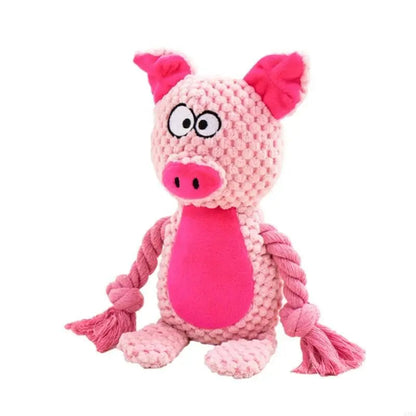 De knuffel als roze varken met felroze snuit en touwarmen